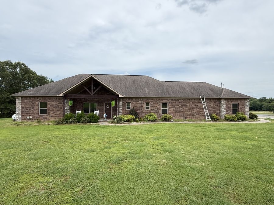 Brick home roof before replacement by Presley Roofing