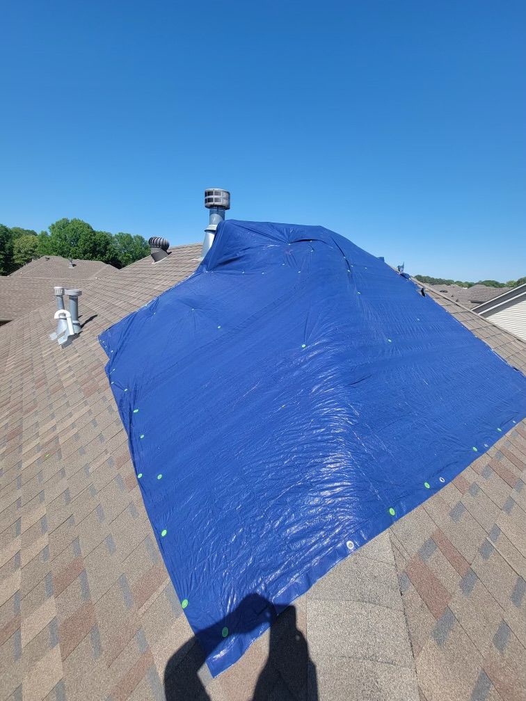 Emergency roof tarp installed by Presley Roofing after storm damage